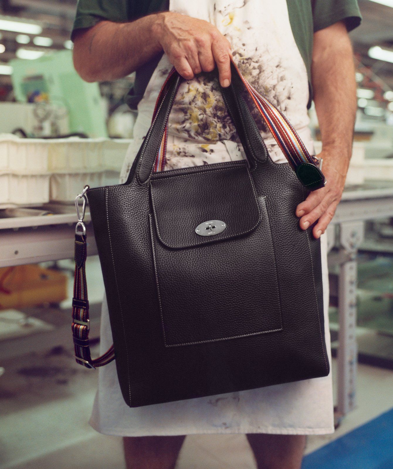 mulberry worker holding mulberry paul smith antony tote bag in black